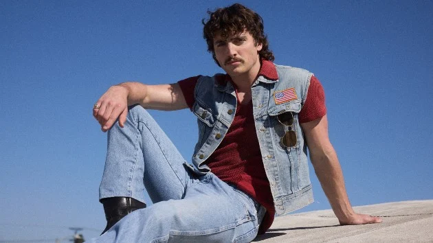 Benson Boone pokes fun at himself in new video for Mr. Electric Blue